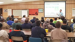 Image showing people watching a presentation.