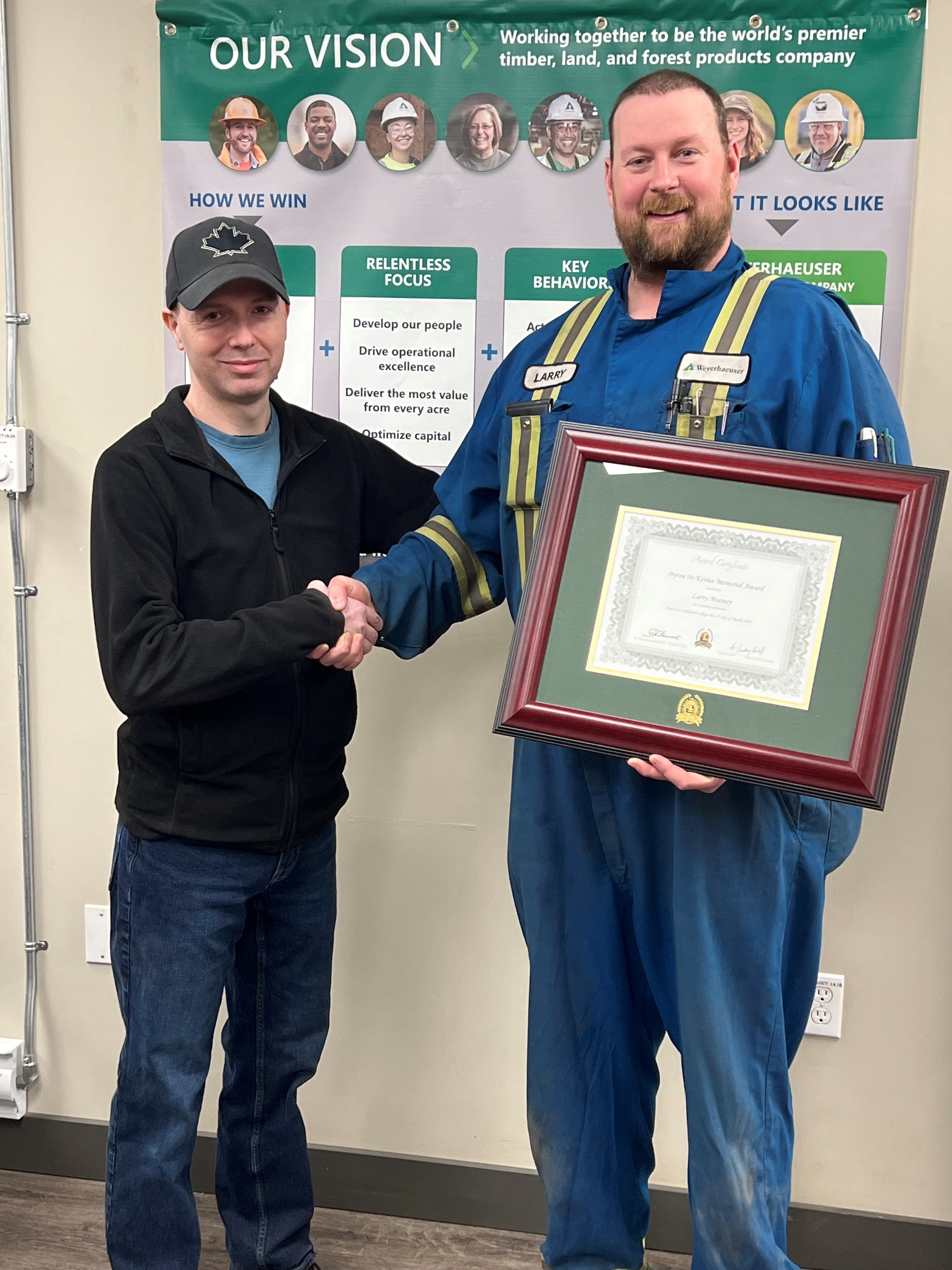 Image of Tom Wolsey, Drayton Valley maintenance manager, and Larry Mooney with his Byron McKenna Memorial Award for Safety certificate.