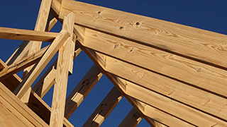 Image of Weyerhaeuser wood products used to frame a house on a job site.