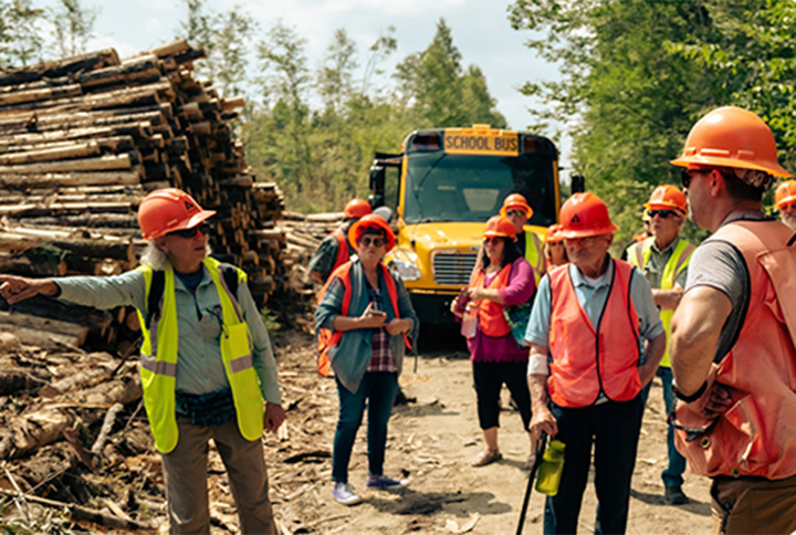 A group tours a Weyerhaeuser timberlands operation.