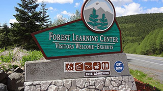 Image of a sign welcoming visitors to the Mount St. Helens Forest Learning Center.