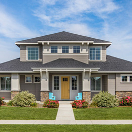 Image of a beautiful house with ornate siding and trim.