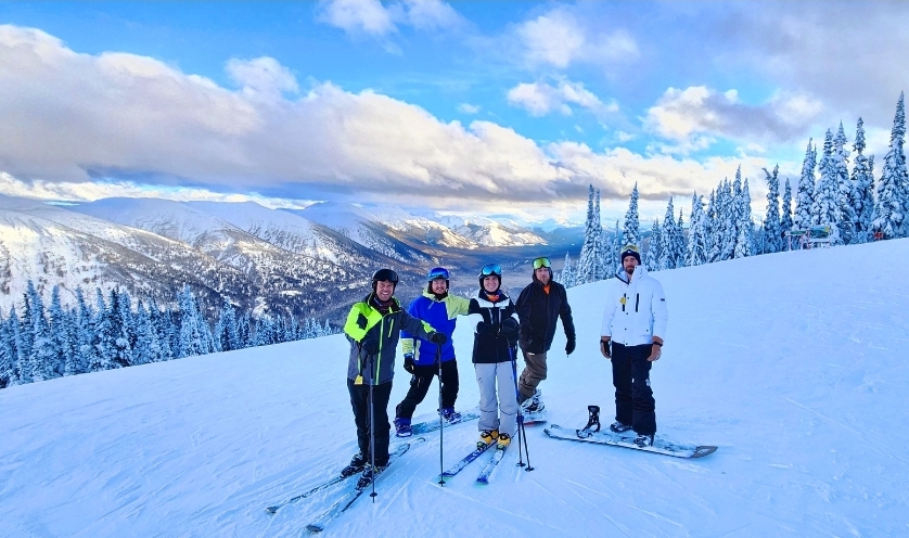 Image of Lonnie Naylor and some friends from the Grand Prairie lumber mill skiing at the Powder King Ski Resort in British Columbia.