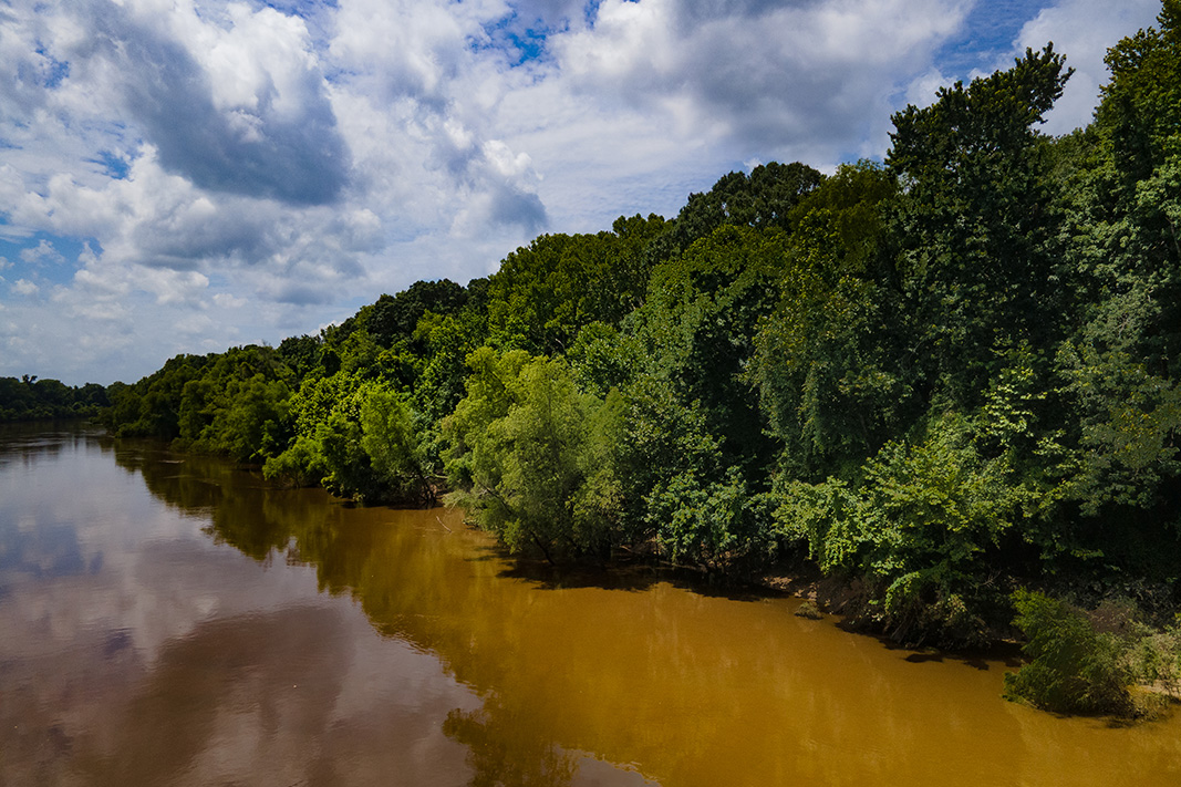 A waterway bordered by forests