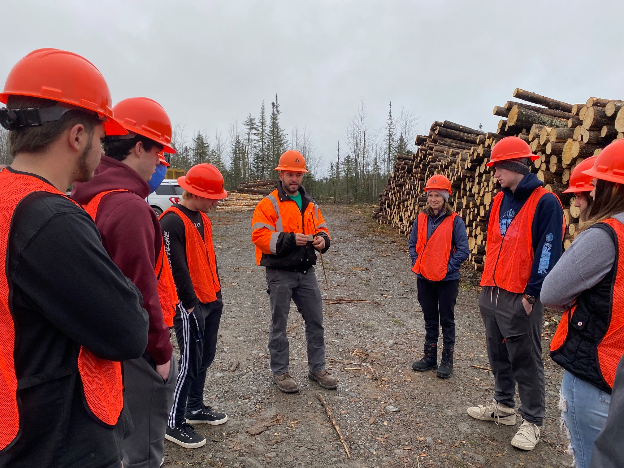 Image of Drew leading a tour for high school students.