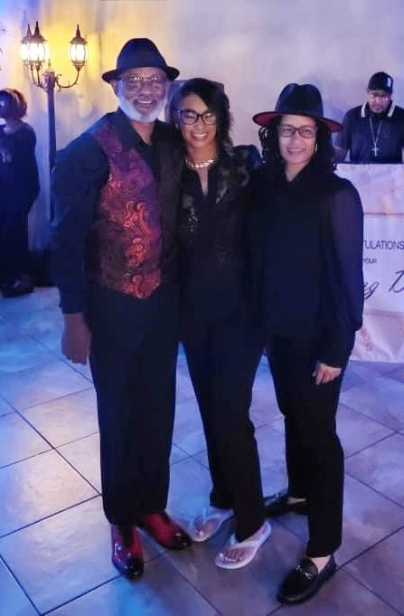 Image of Evelle with her husband, Carlos, and her sister, Raven.