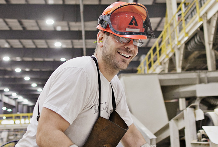 A worker standing at a Weyerhaeuser mill.