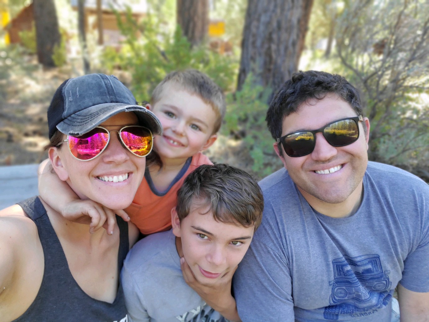 Image of Seth Carpenter, right, with his wife, Heather, and sons, Myles and Nolan, during a hike in the Oregon Cascades.