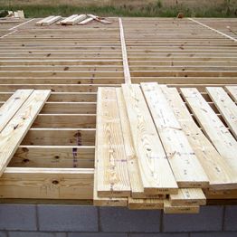 Pro Series lumber being used to construct a floor on a work site.