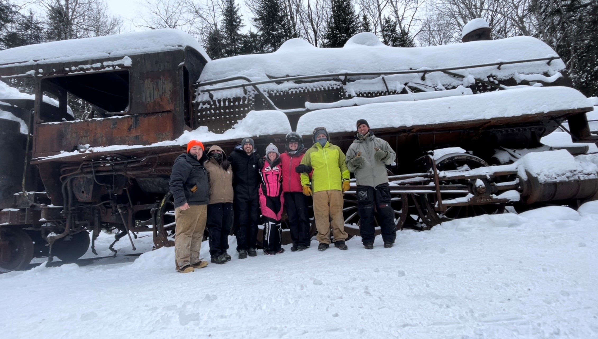 Image of Cullen and friends after they found the legendary steam locomotives at Eagle Lake.