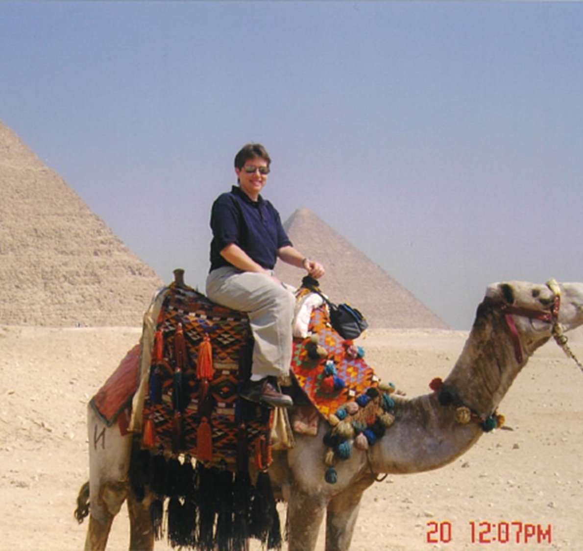 Image of Renee Kelley, Buckhannon's safety coordinator, riding a camel in Cairo, Egypt. 