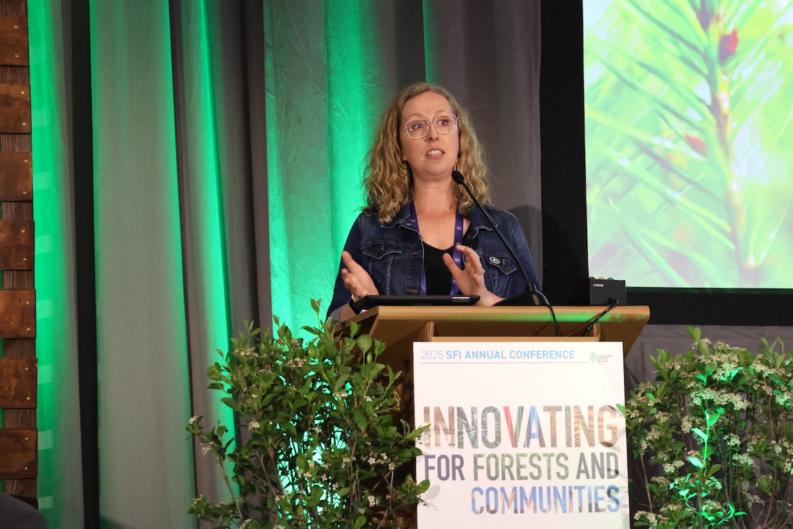 Image of Lisa mid-sentence as she is presenting at the 2025 SFI conference.