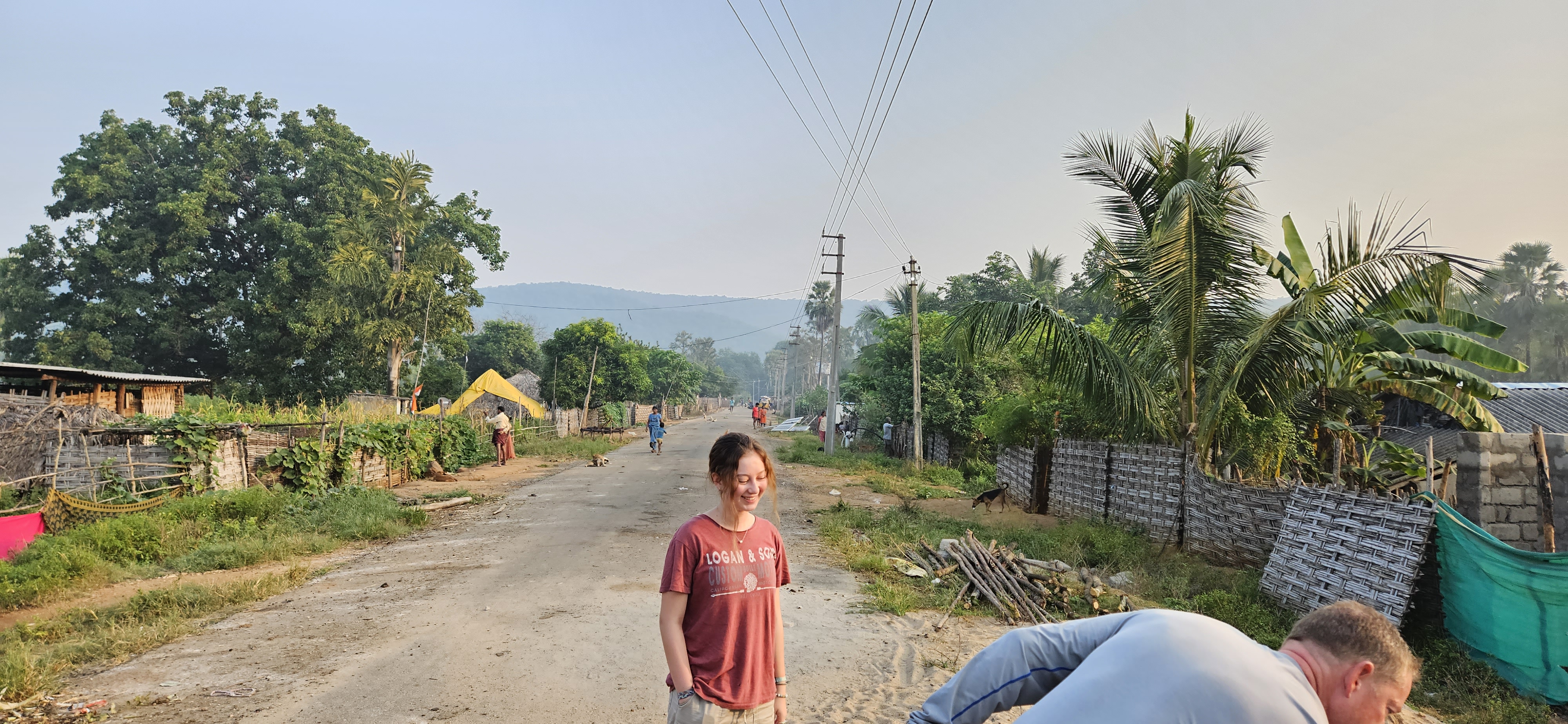 Image of Anna, another Aasha volunteer, standing in the main road running through Kattakur.