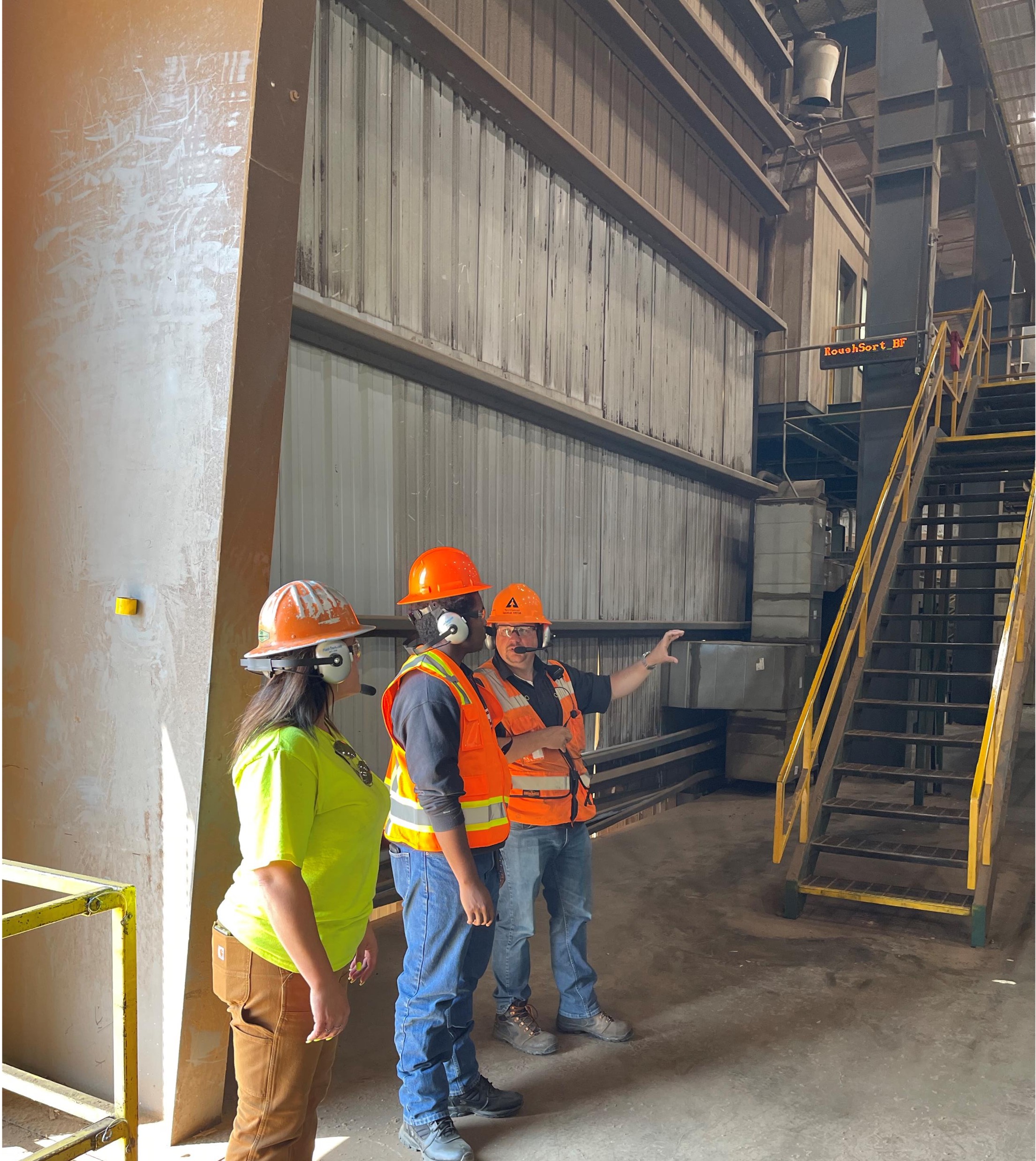 Image of Leesha and Danny getting a tour of the Santiam mill from George Virtue, Santiam operations manager.