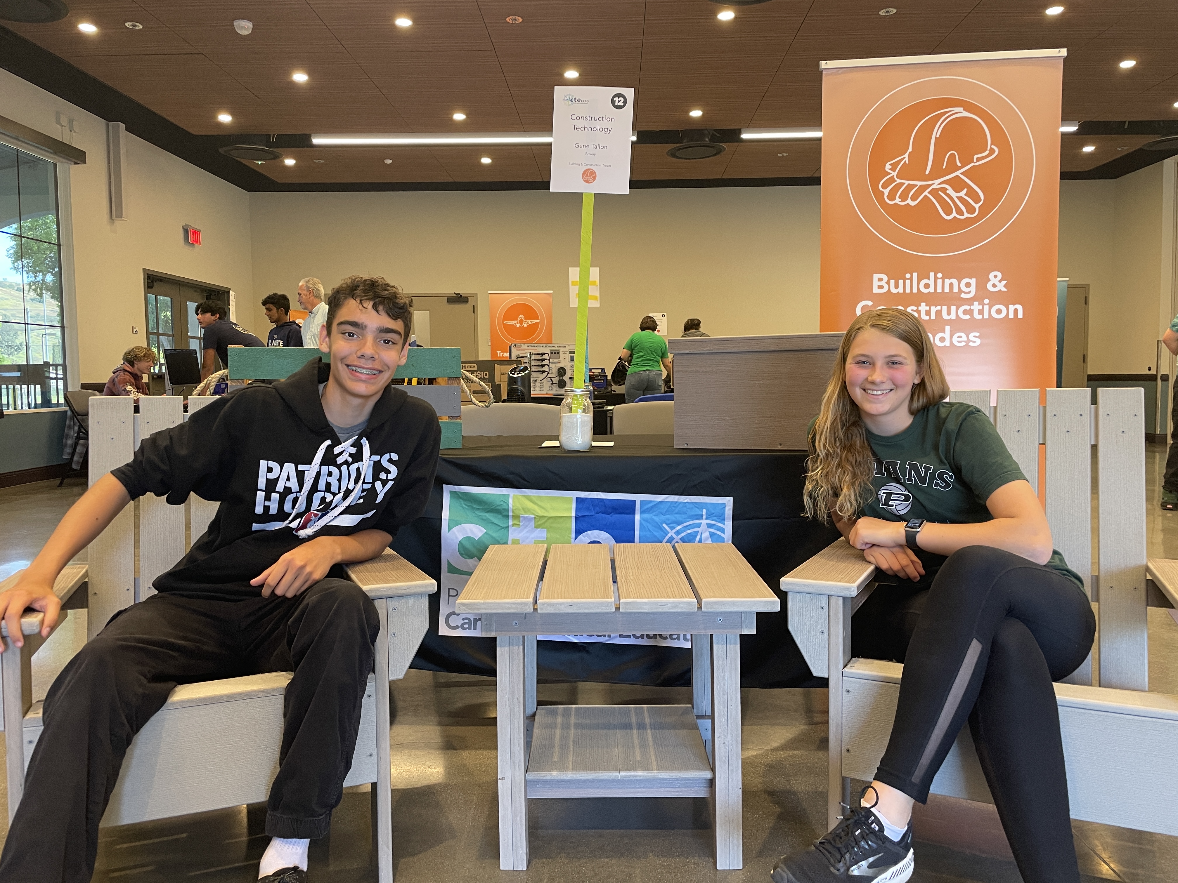 Image of Poway students who also built Adirondack chairs, end tables and coffee tables from donated decking.