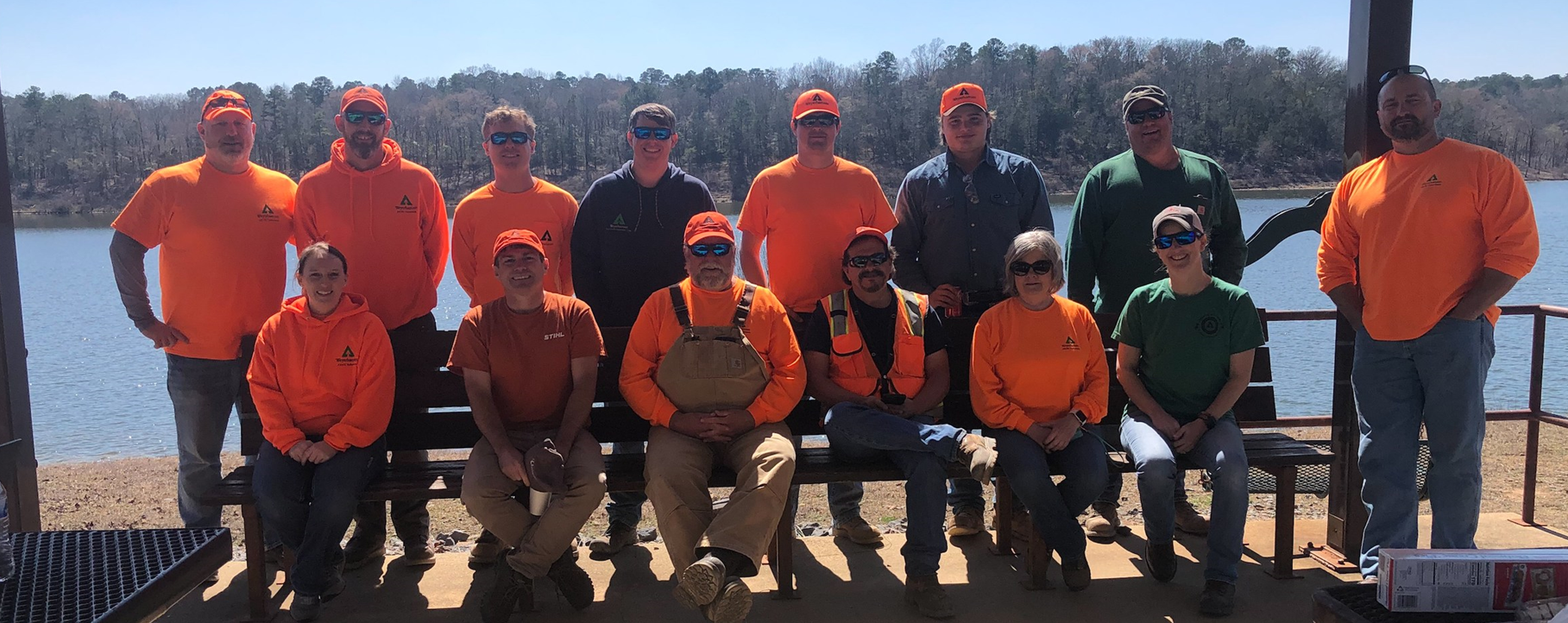Image of Katie, seated at far left, with a group of volunteers.