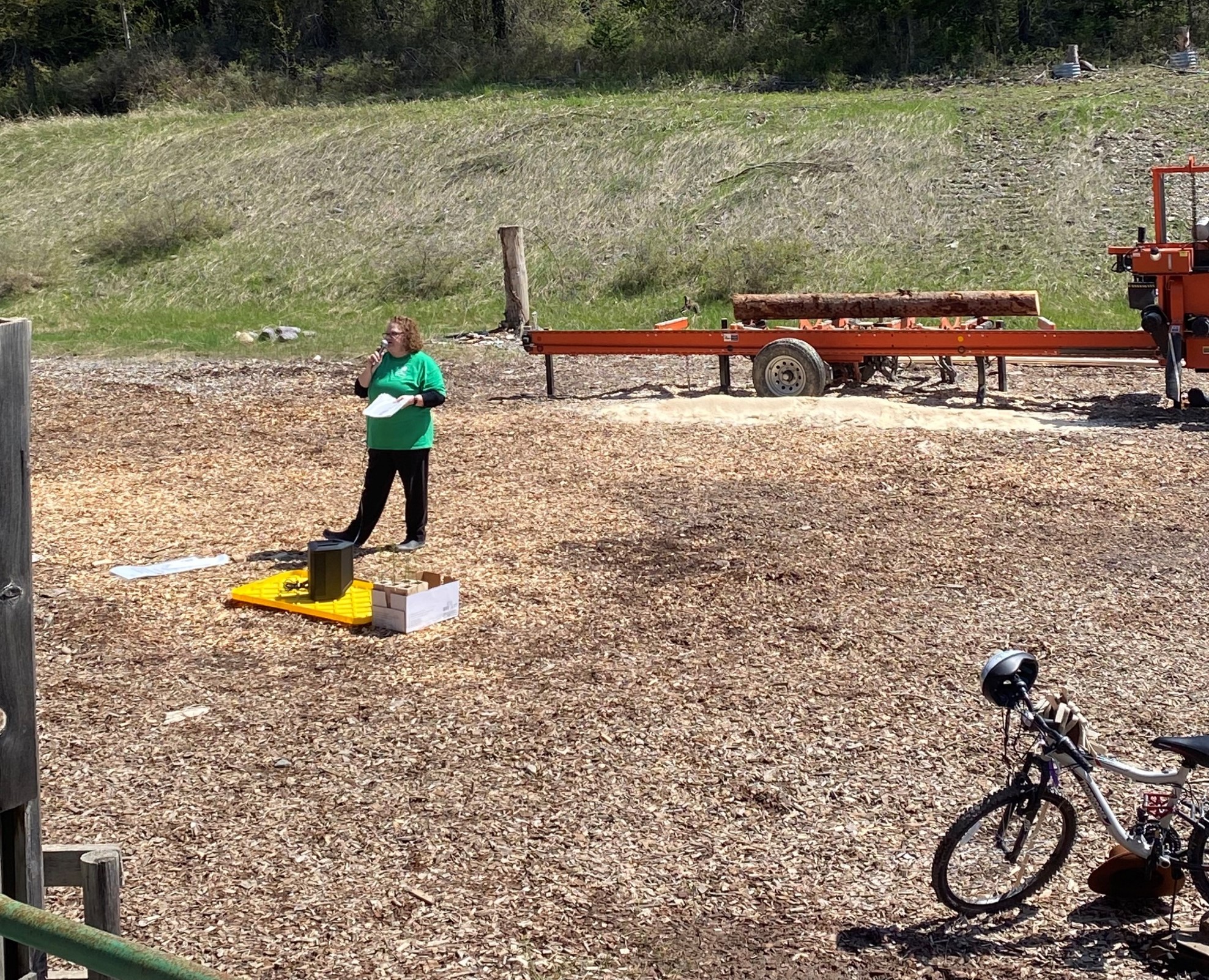 Image of Elise, shown presenting Douglas-fir seedlings to each class.