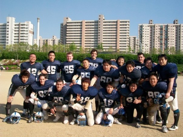 Image of Josh playing football on his college team in Seoul, South Korea.