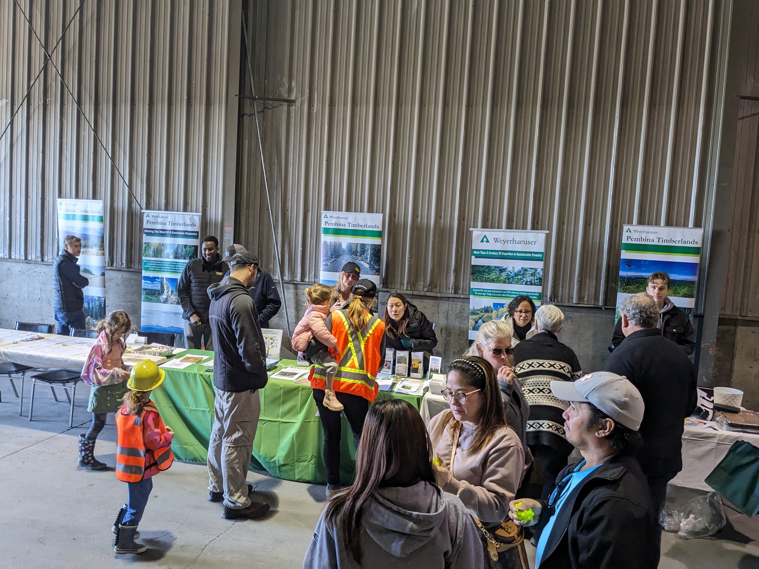 Image of employees from the Edson OSB, Pembina Timberlands and Edmonton Sales office set up tables to share information on what and who we are.
