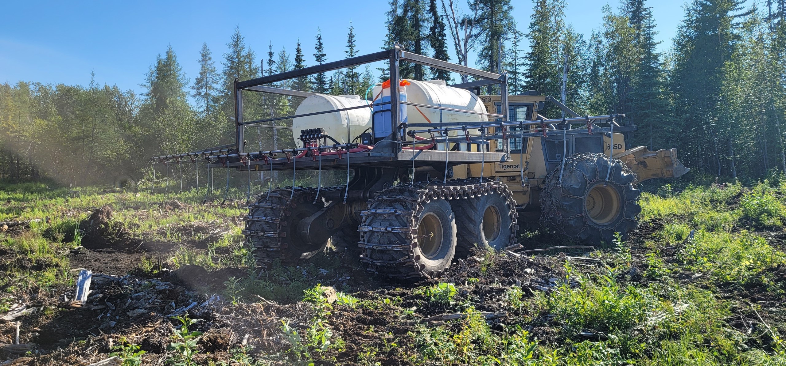 The skidder equipped with a GPS unit and spray arm. 'Not only does this technology allow us to be more precise than ever, it gives us a lot more data to learn from at the end of the season,' Tyler says.