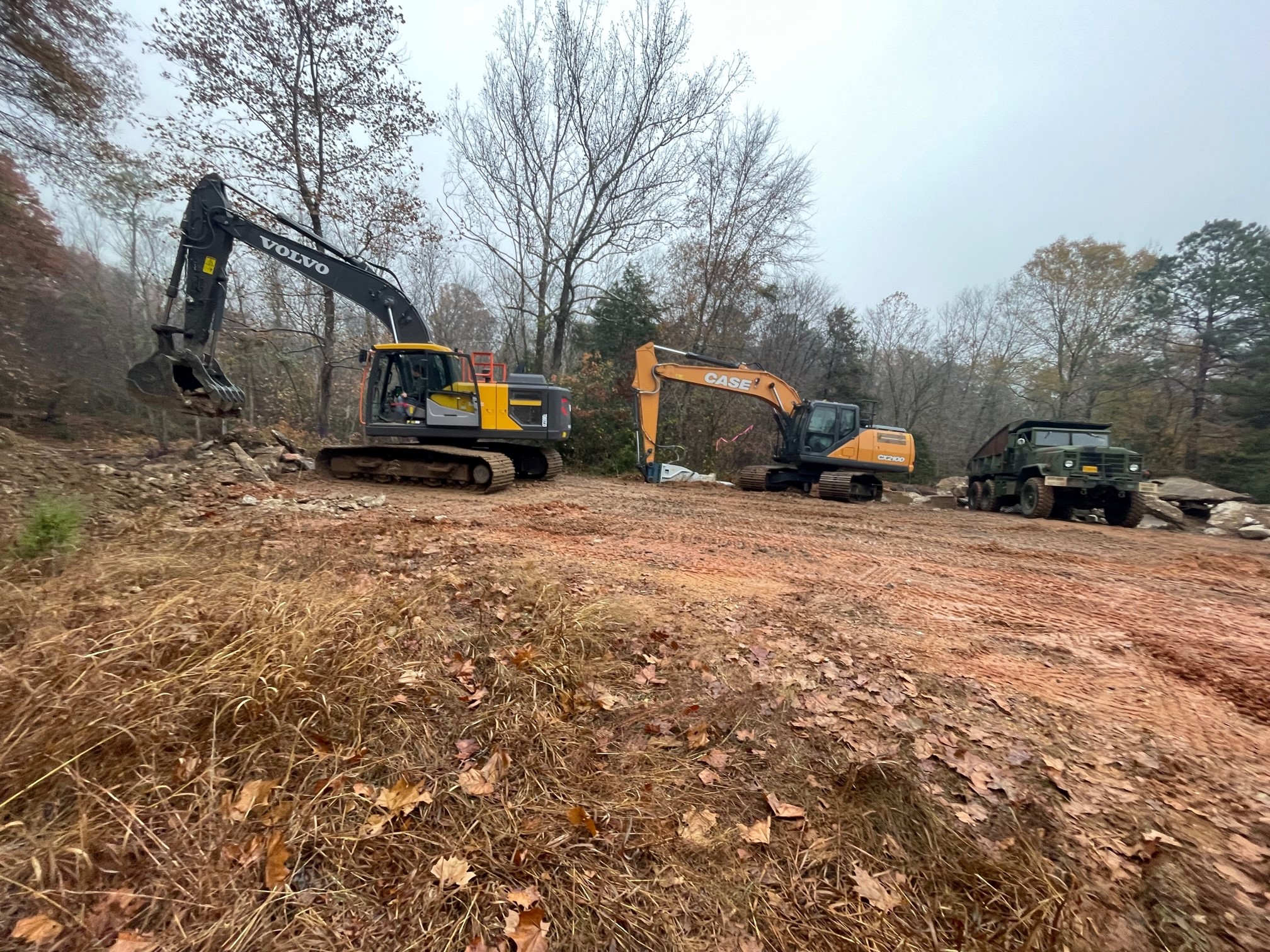 Image of trackhoes as they prepare to remove the old crossing over the Saline River.