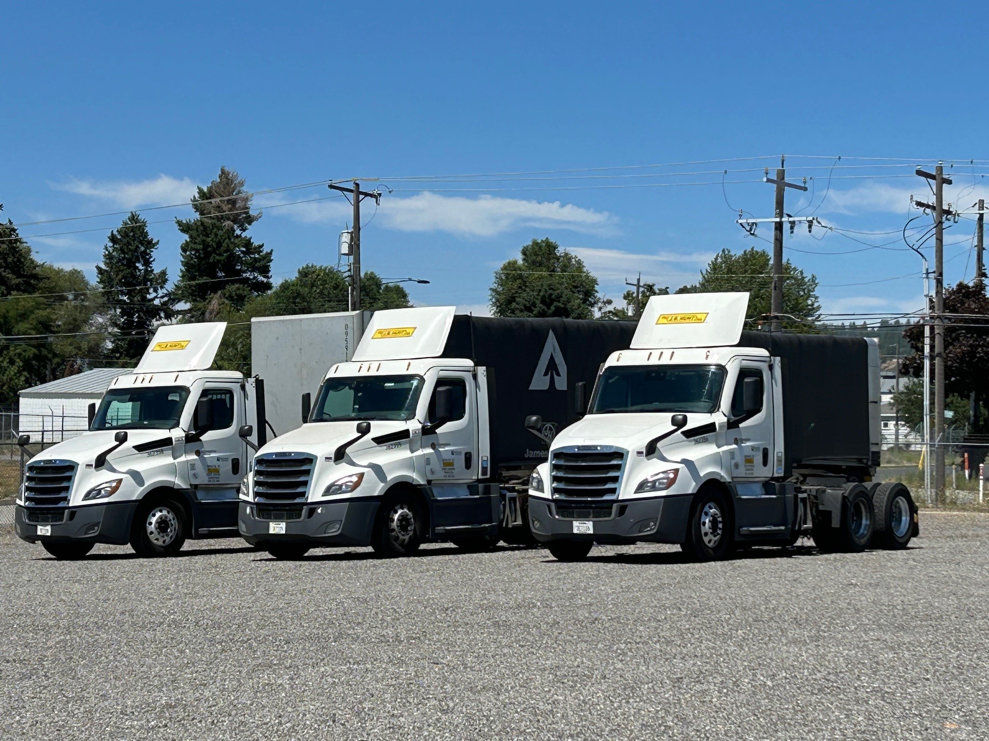 Image of trucks outside the new distribution center, ready to take wood products to customers.