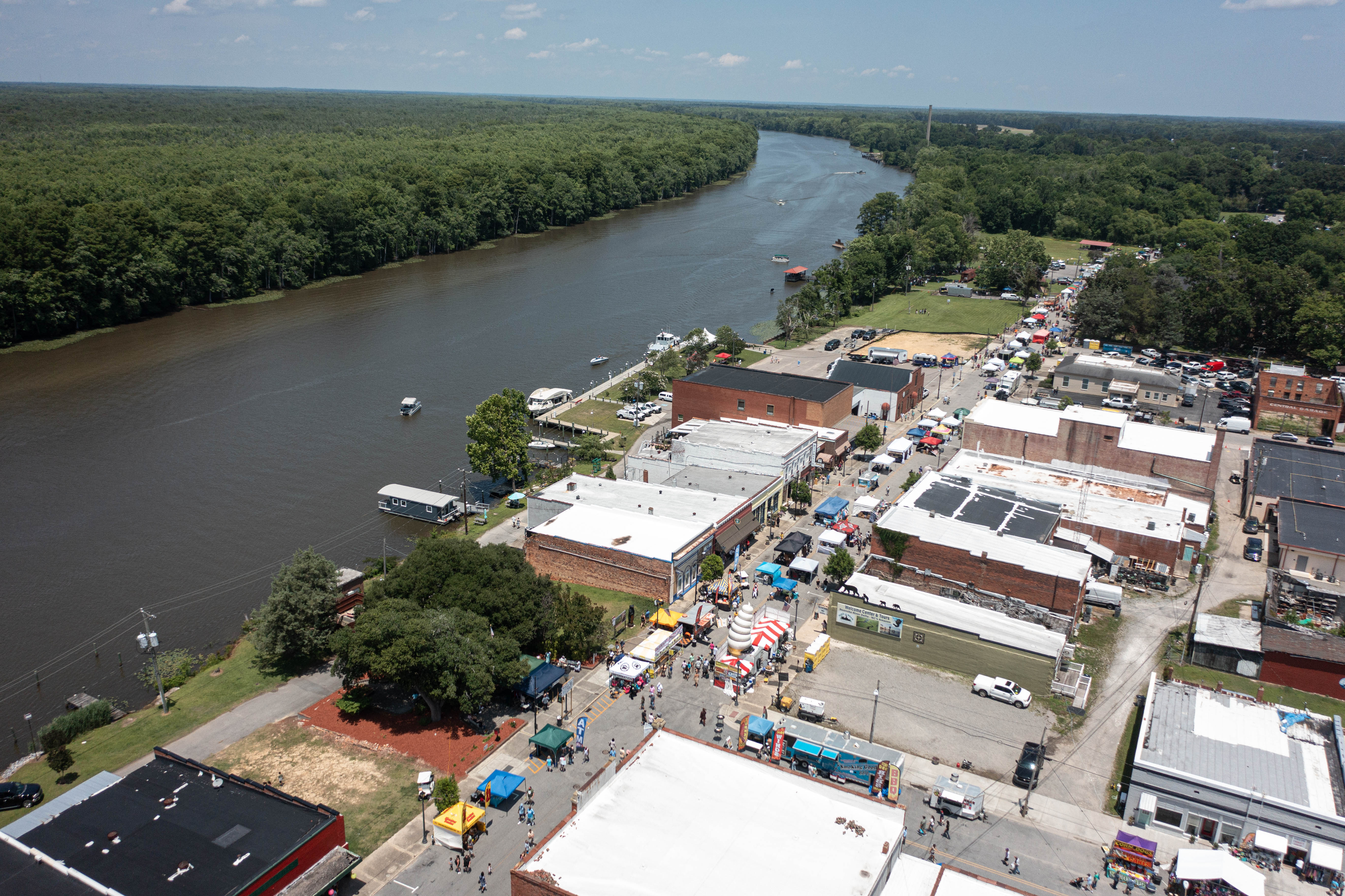 Airial view of the Black Bear Festival in Plymouth, N.C. showing crowds along the main street, which backs onto the river.