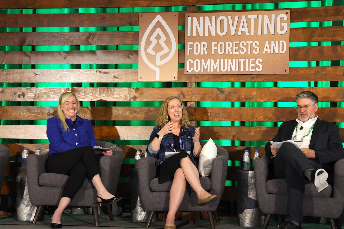 Image of Lisa sitting in the center of the photo, participating in a palen discussion.