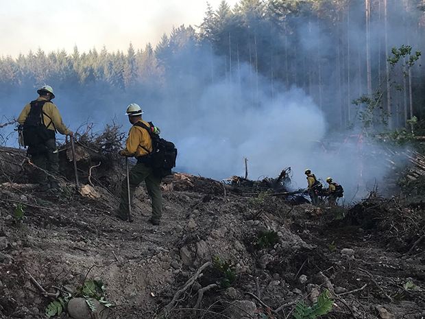 Vail team fighting a fire