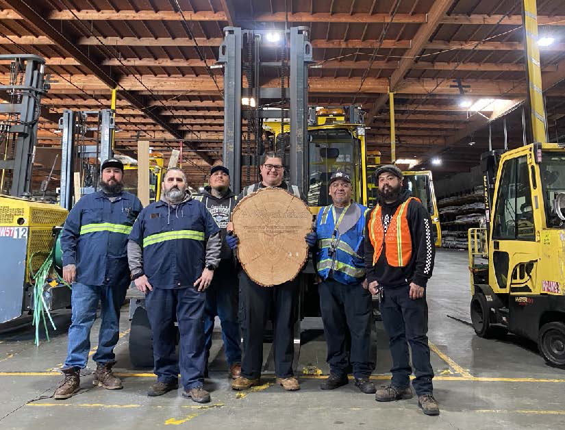 Image of the Fontana nigh crew ith the plaque.