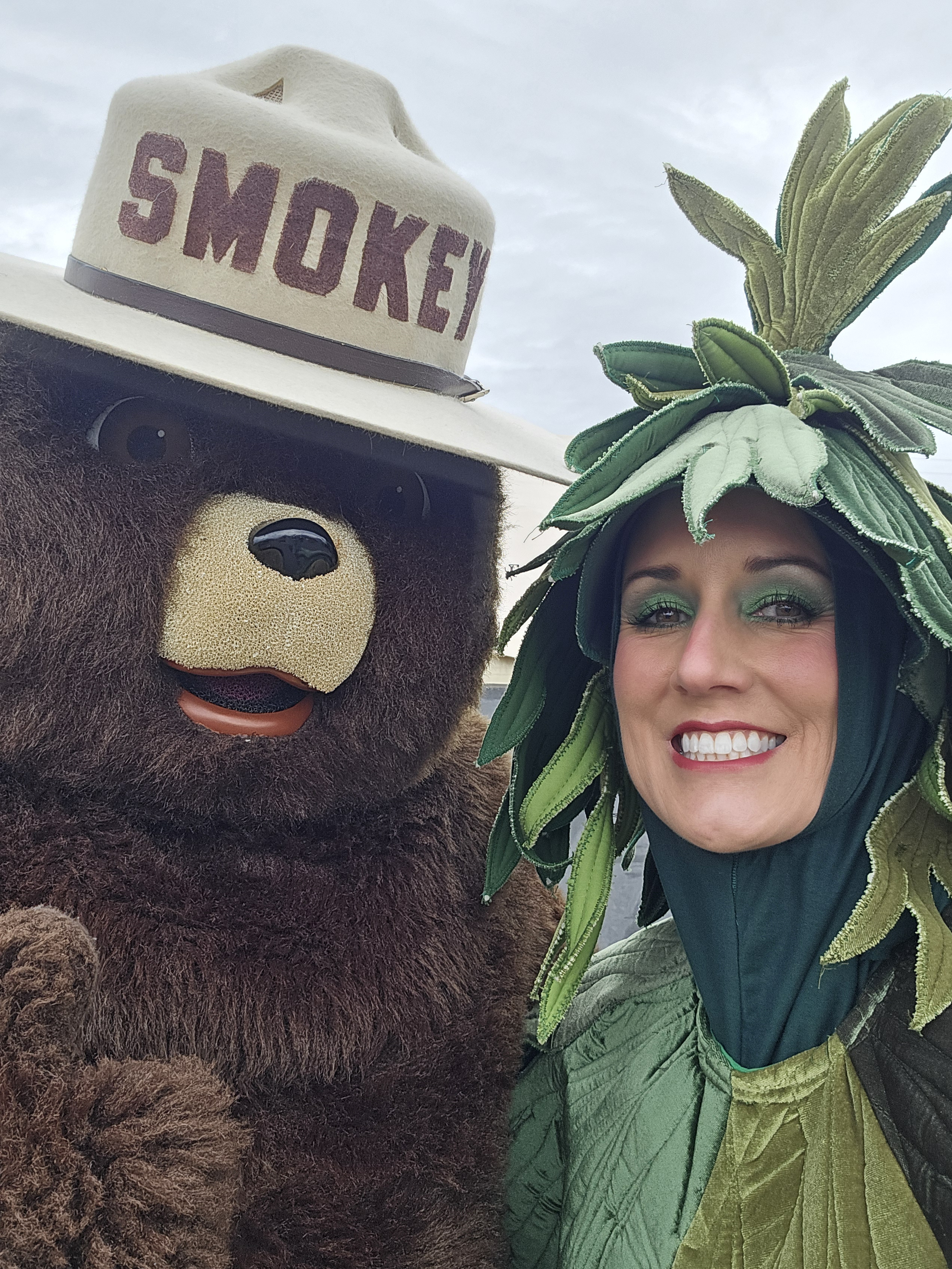 Image of Jill in a tree costume with Smokey the Bear.