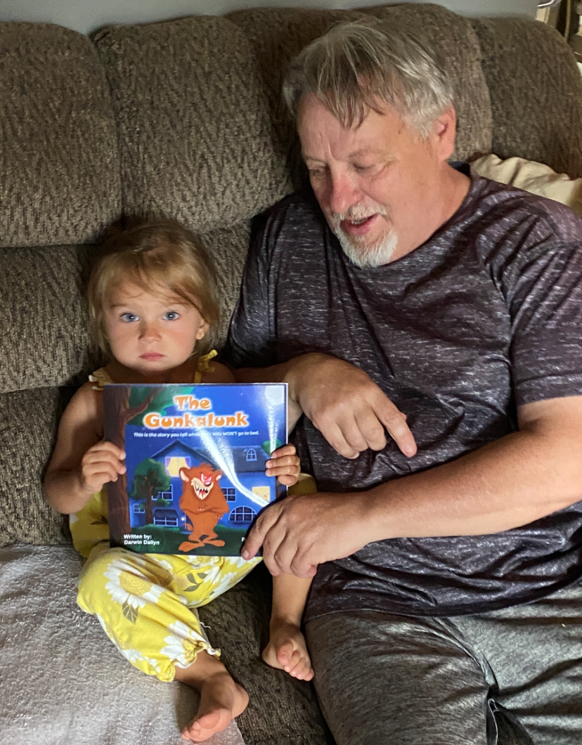 Darwin shares 'The Gunkalunk' with his oldest granddaughter, Athena.