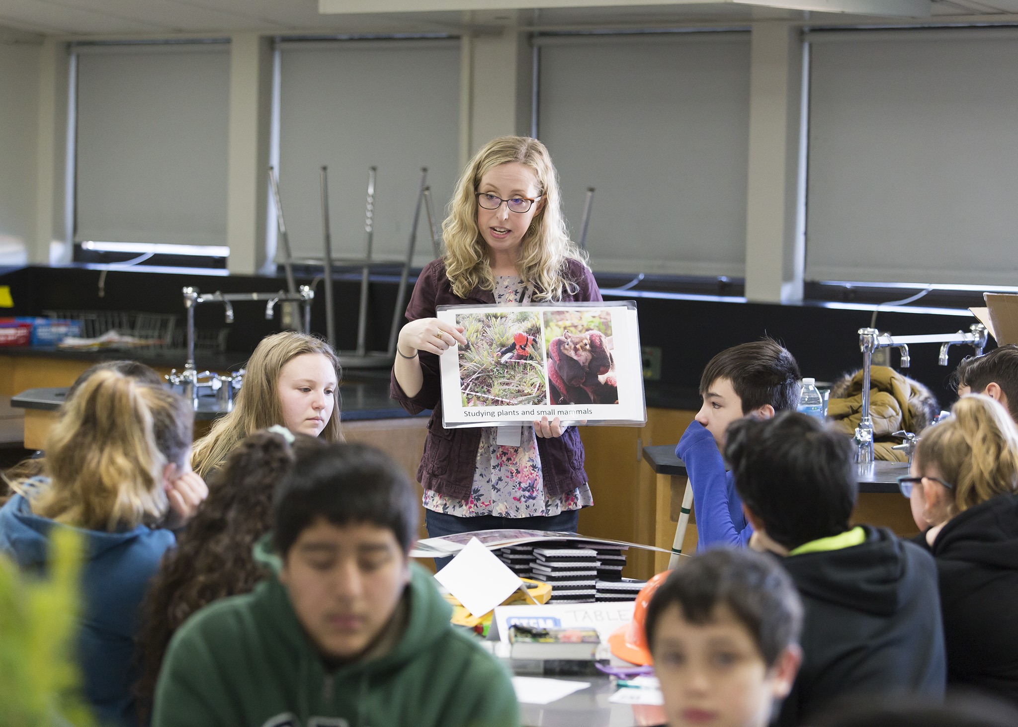 Laura speaking with students in 2019.