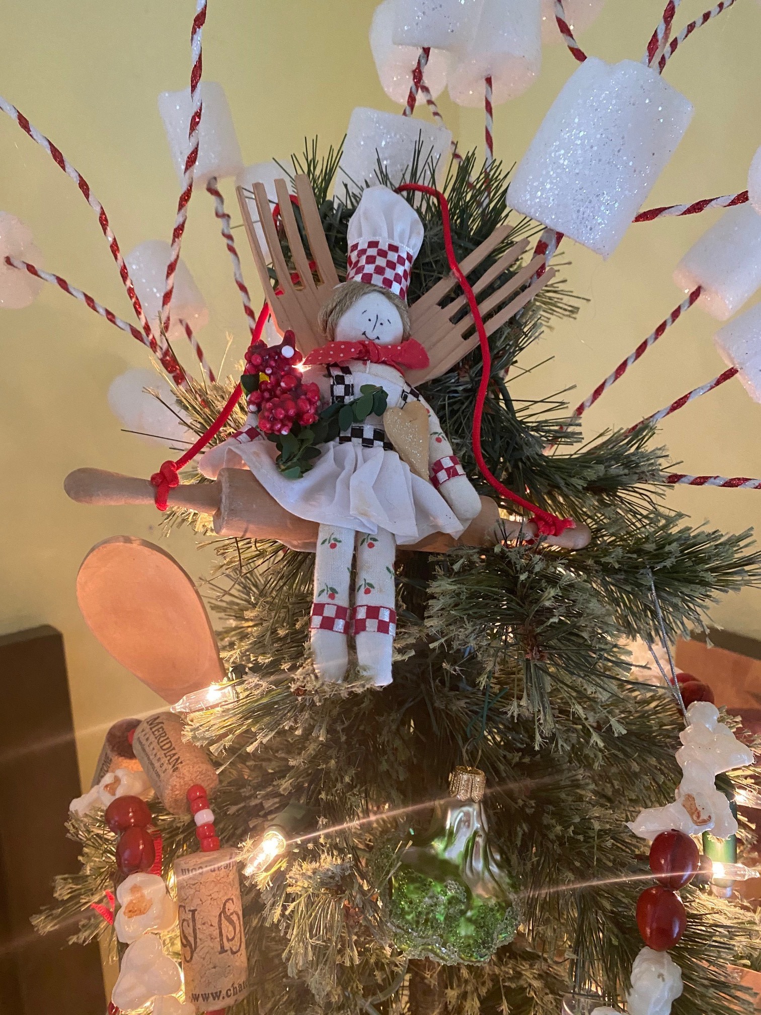Ginny loves Christmas and says she’s 'cut down' to just four Christmas trees! This is the tree topper for her kitchen tree.