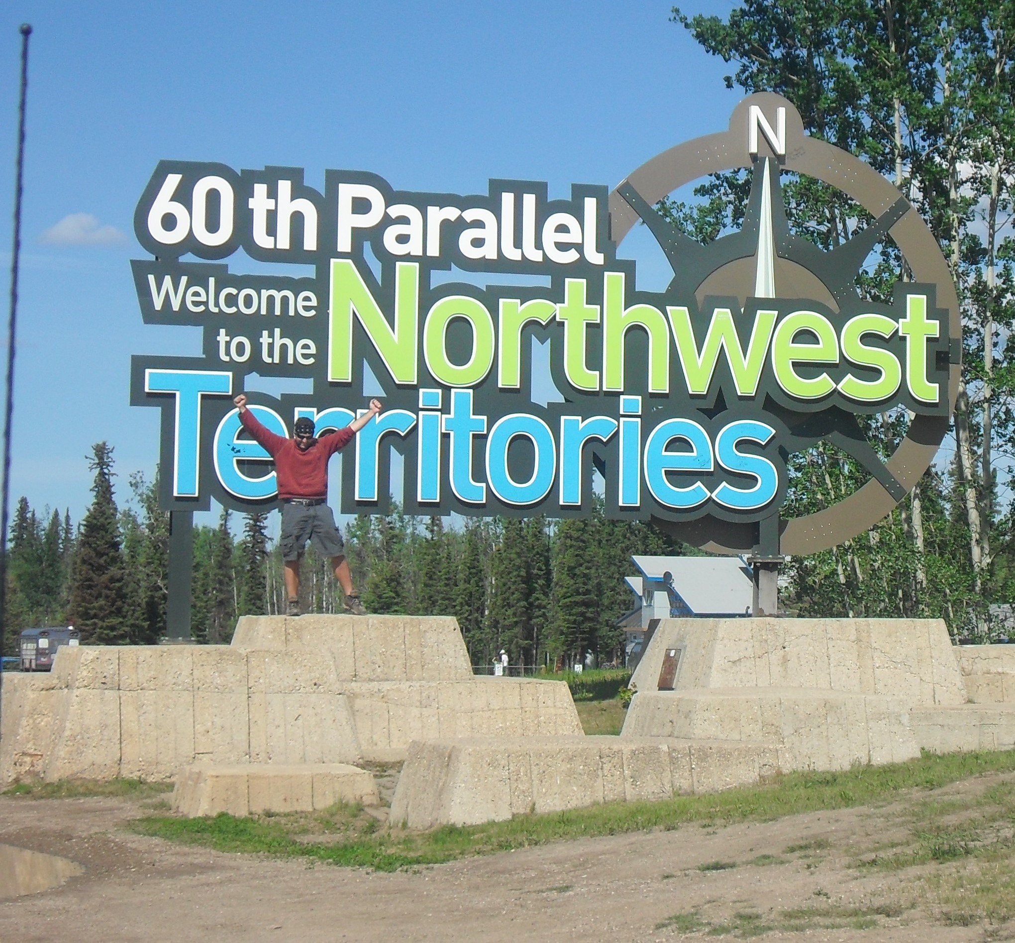 Erik stops at the welcome sign for Canada’s Northwest Territories on his way up to Great Slave Lake.