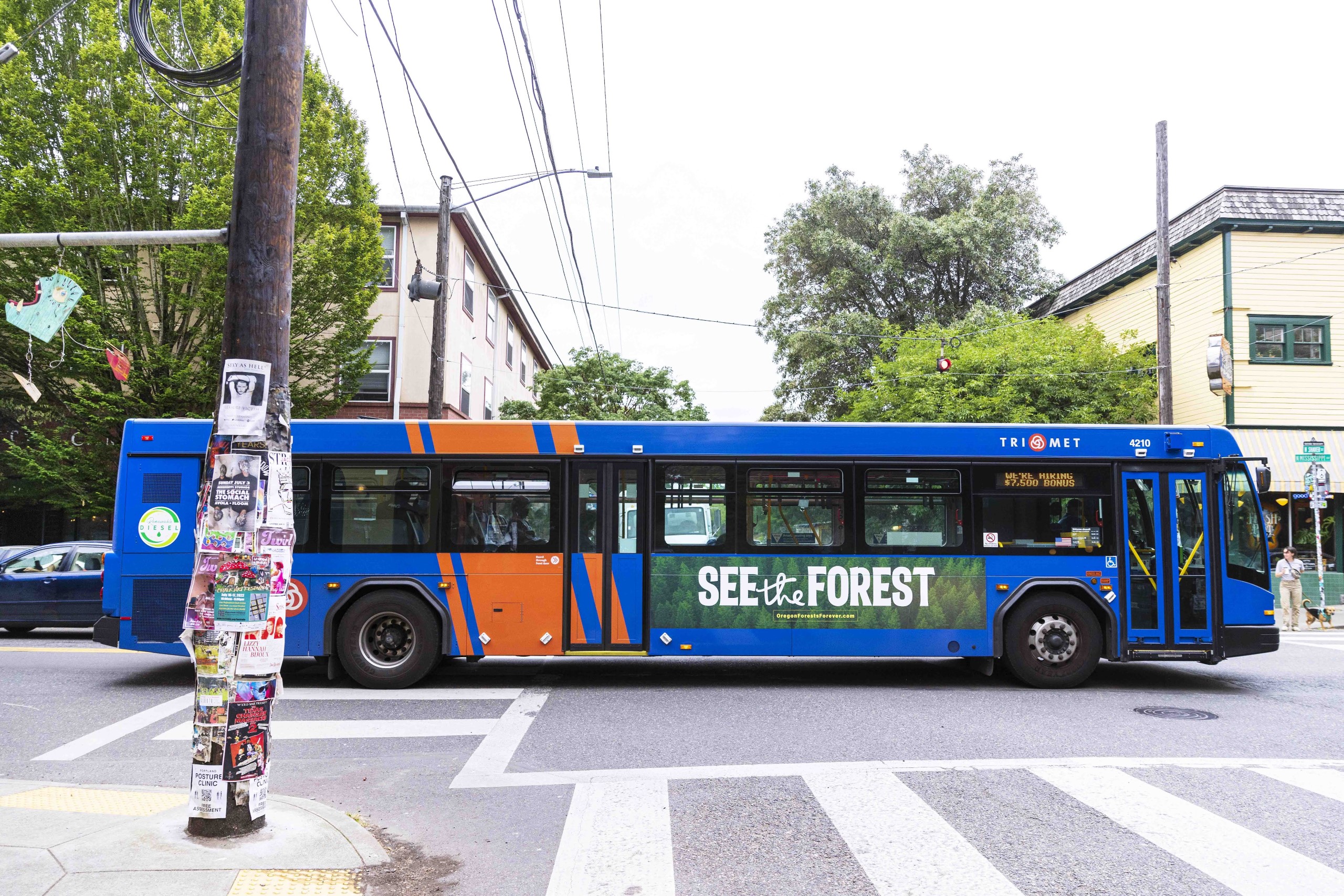 A bus in Portland displaying a version of the For the Trees ad.