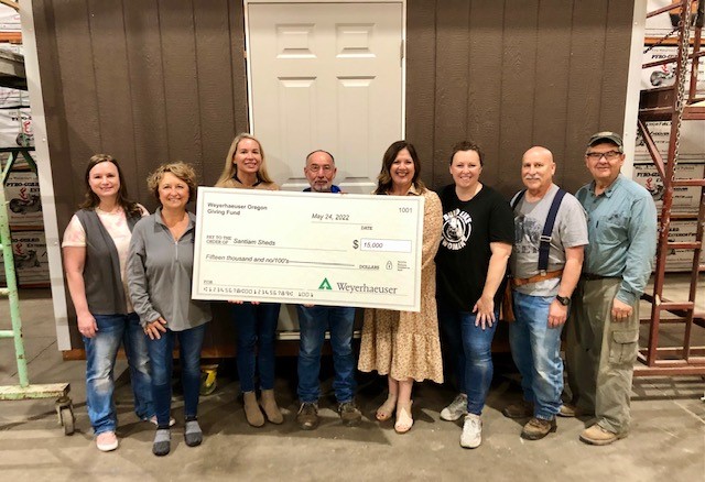 Weyerhaeuser supported the Santiam Shed builds with a $15,000 donation. From left, Weyerhaeuser employees Dana Cunningham, Cara Barnes and Kyleigh Gill; and shed project volunteers Marv Shetler, Juli Foscoli, Stephanie Bobb, Chuck Johnston and Bob Emanuel.