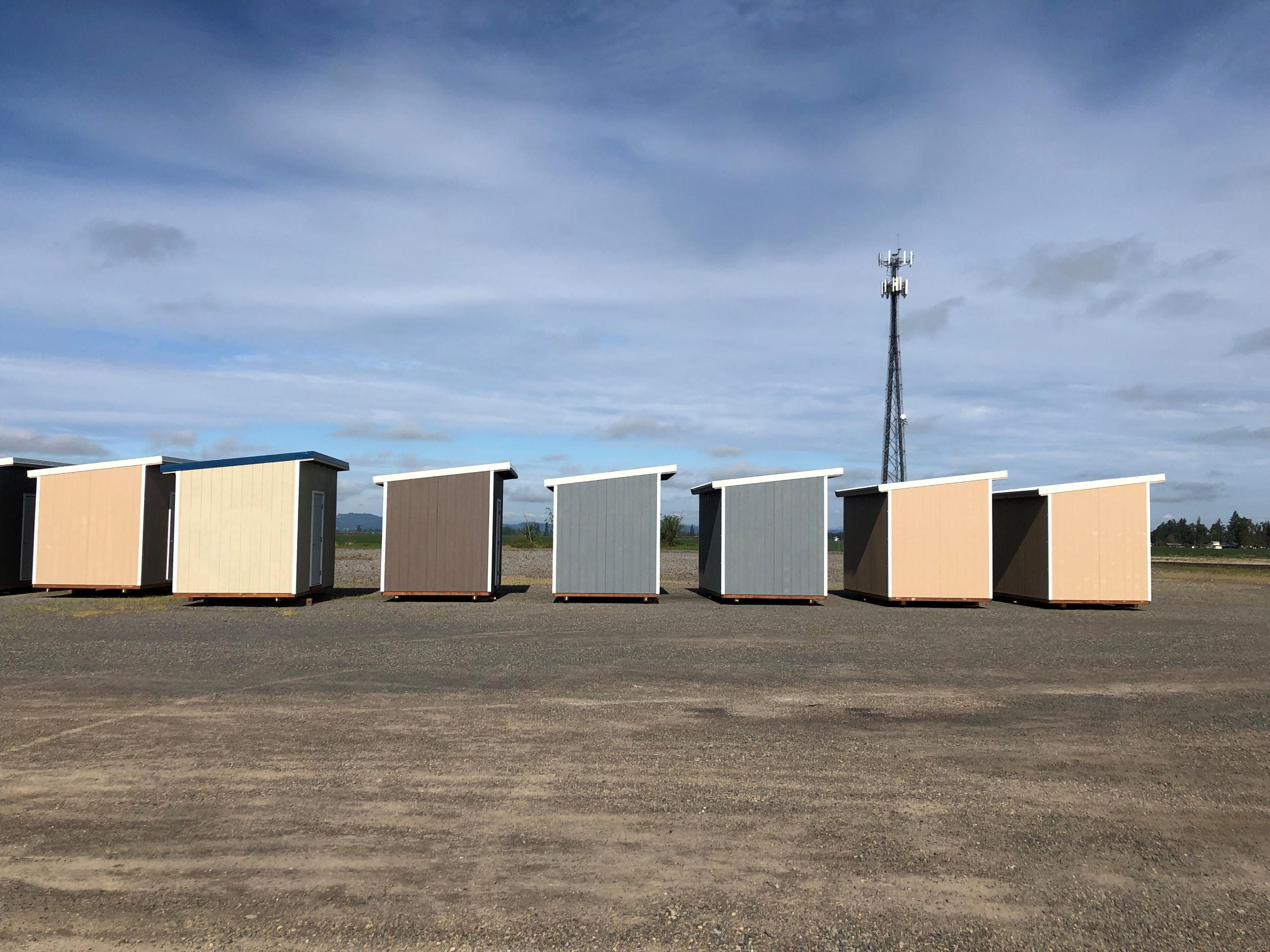 A row of completed sheds awaiting delivery to families in Santiam Canyon.