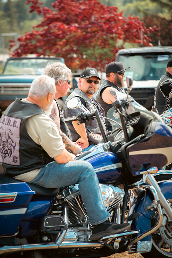 Men on motorcycles socialize during the Willapa Harbor Festival.