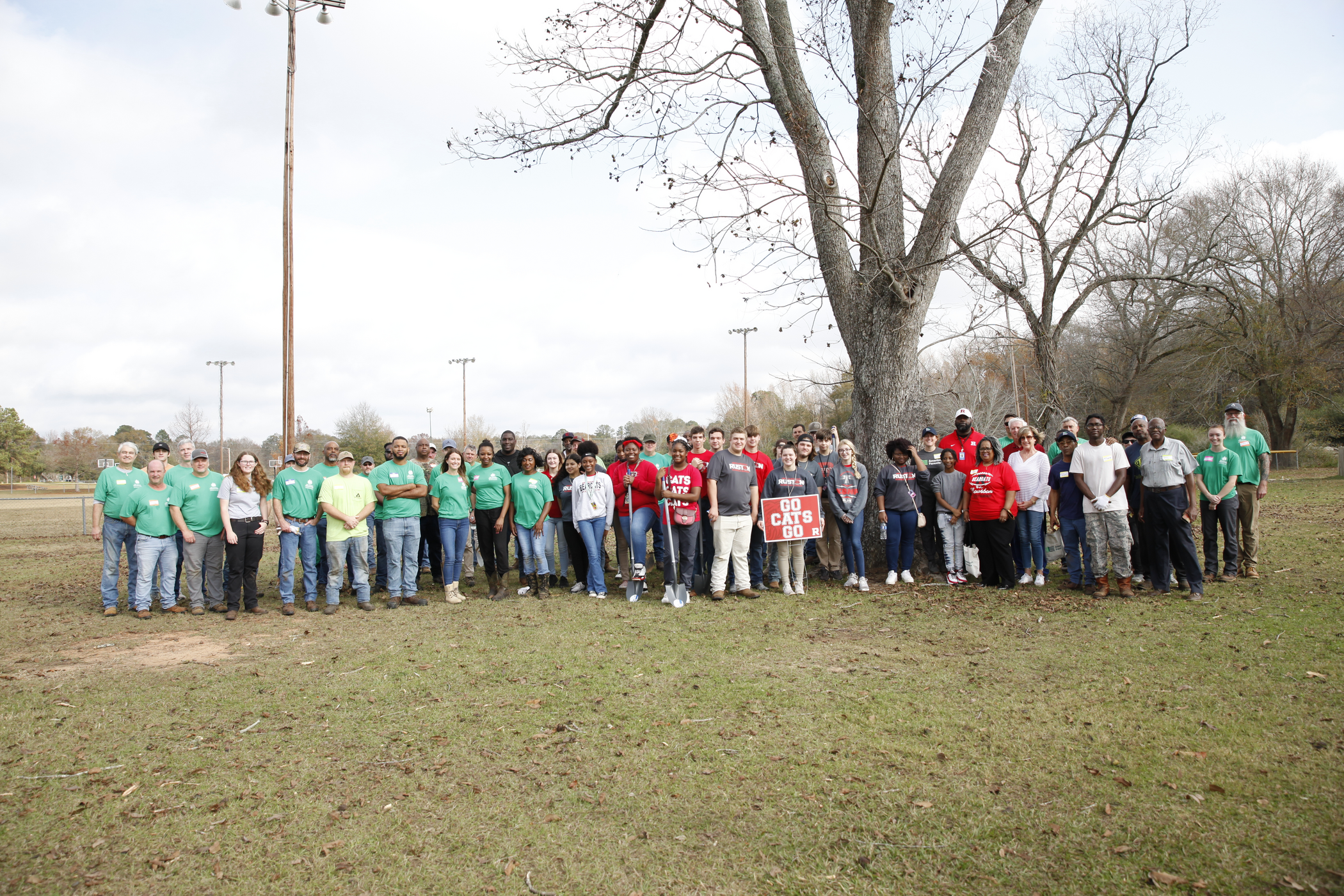 Image of volunteers from Weyerhaeuser, Ruston High School and American Forests gathered before planting trees in Duncan Park.