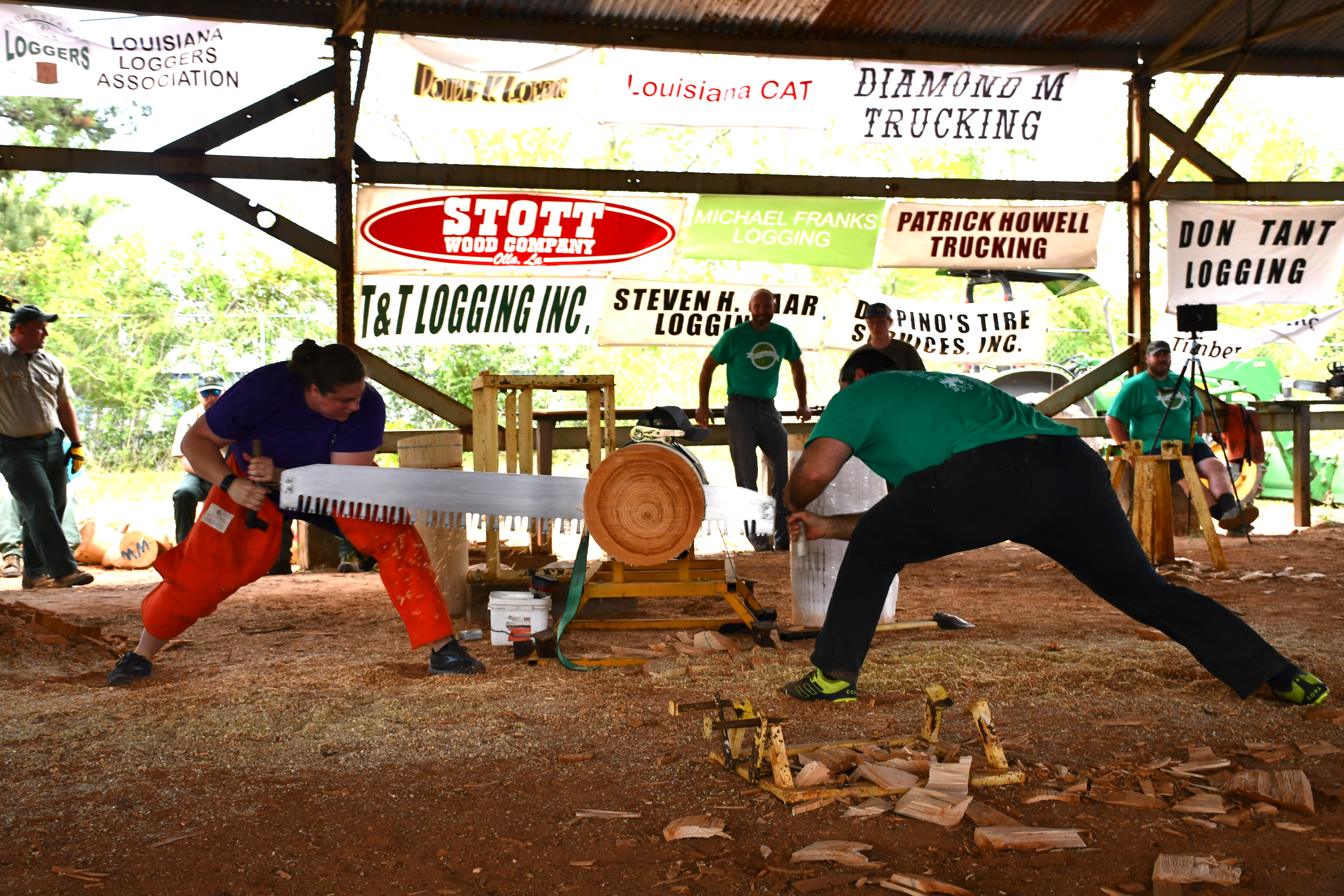 Image of Chelsea Lopez participating in a crosscut sawing timbersport event in college.