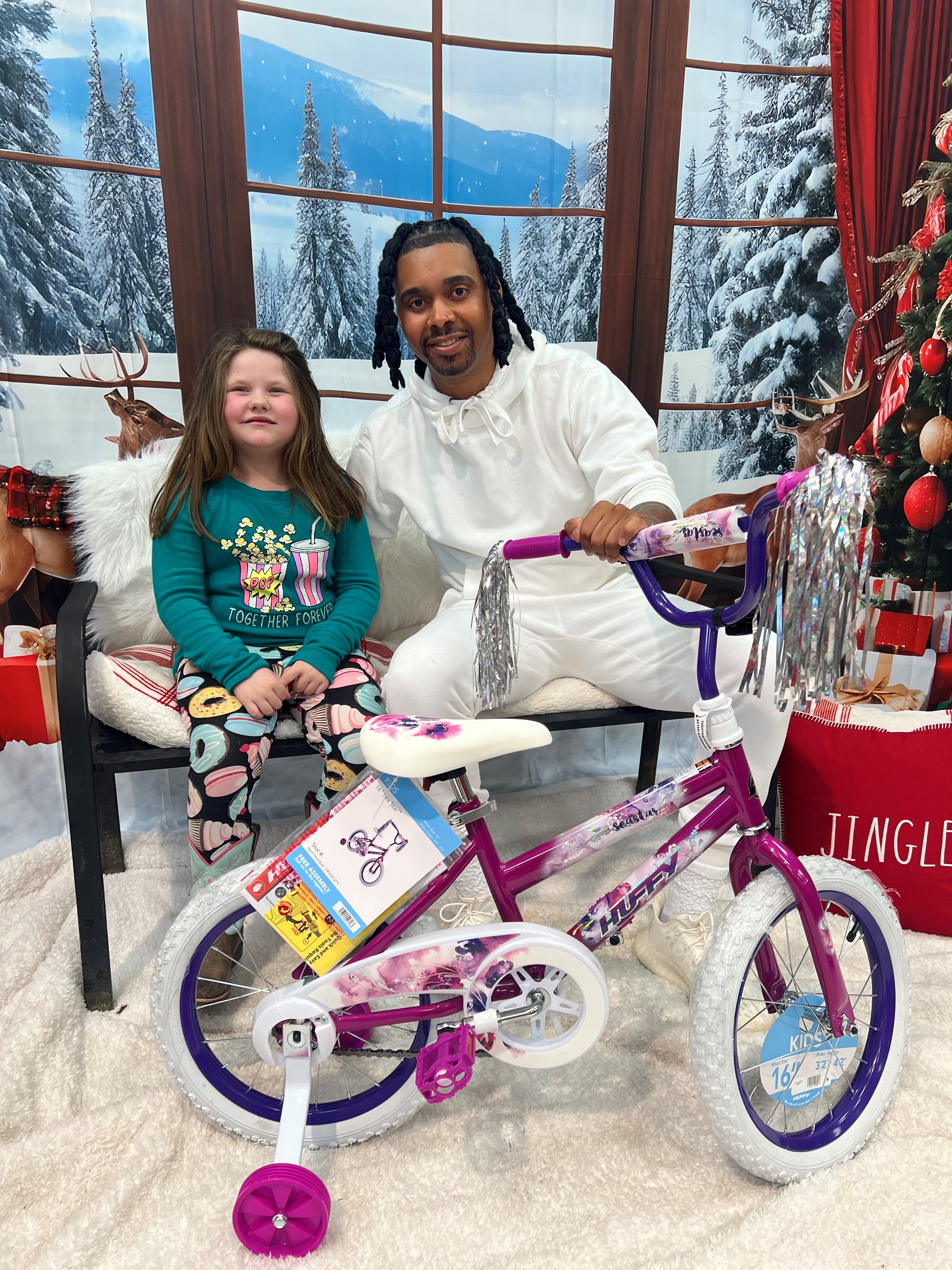Image of Jacob and Kids Over Everything providing gifts to kids during the Christmas season.