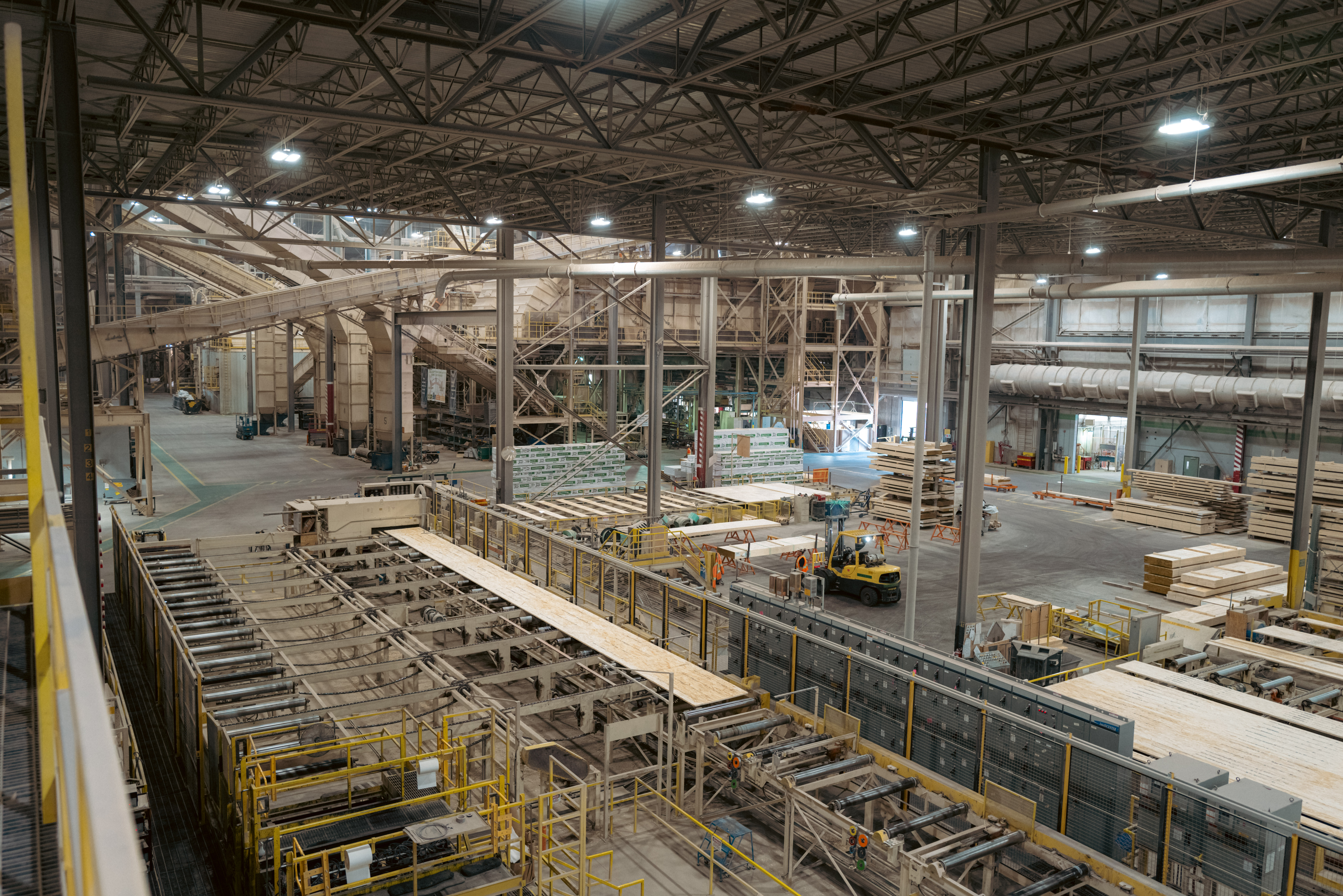 Interior of the Kenora faciliyt showing machines and forklifts.