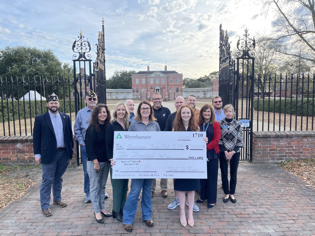 Image of Jocelyn Wilson, N.C. Timberlands region manager, presenting the Trail to Tryon race donation check ot the local American Legion post.