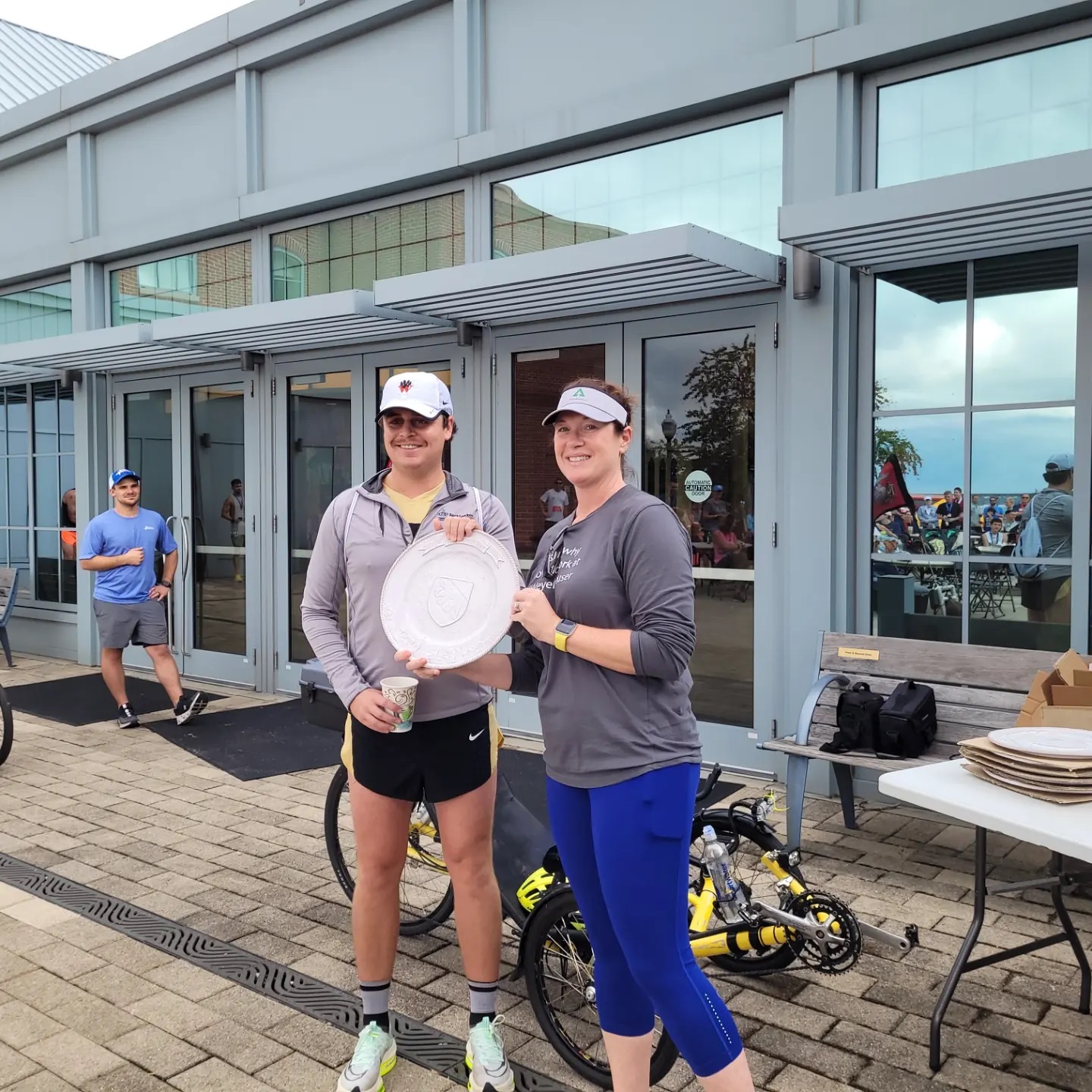 Image of Jocelyn presenting an award to one of the race's top finishers.