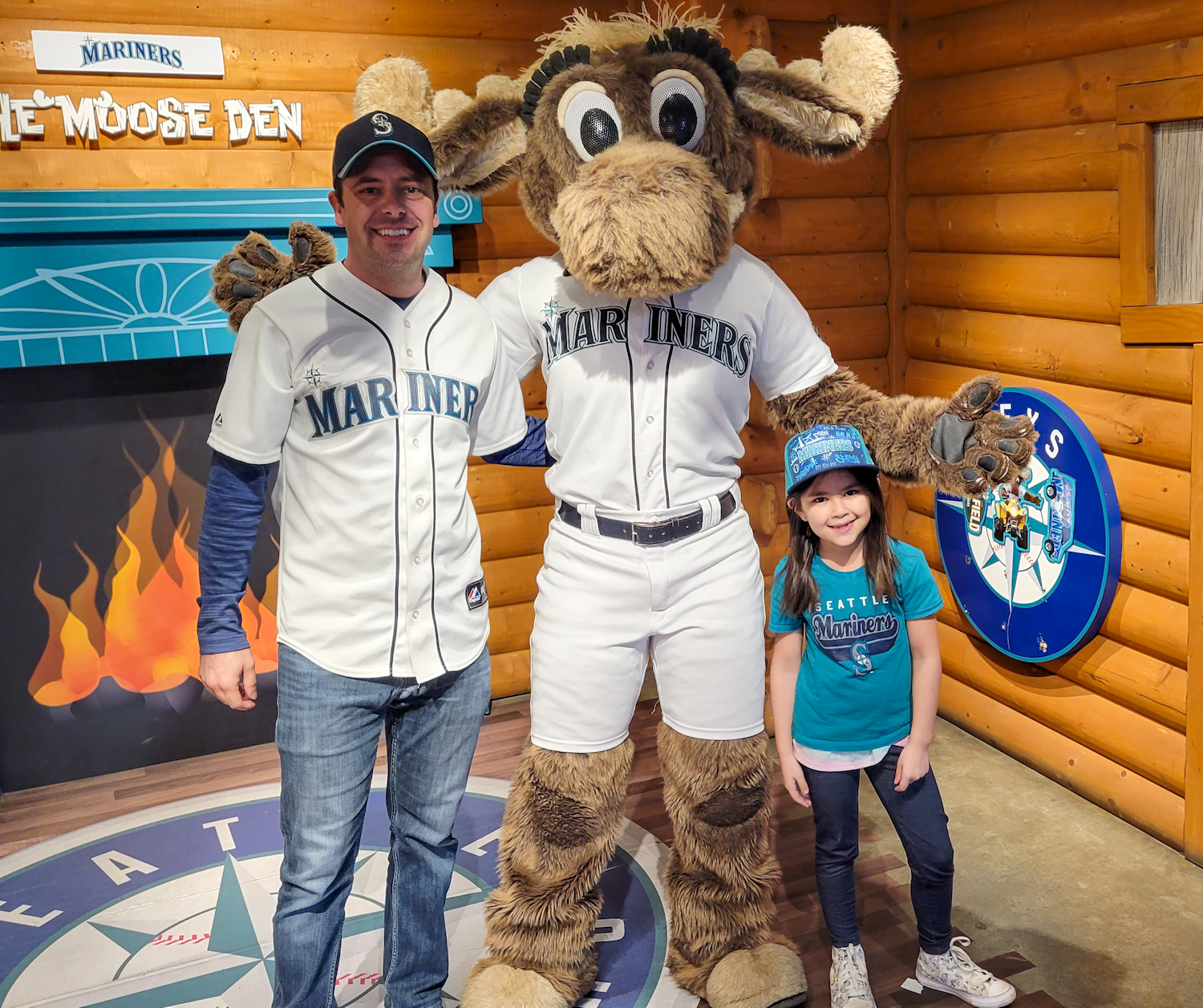 Image of Josh and his daughter, Olivia, along with the Mariners Moose at a home game in Seattle.