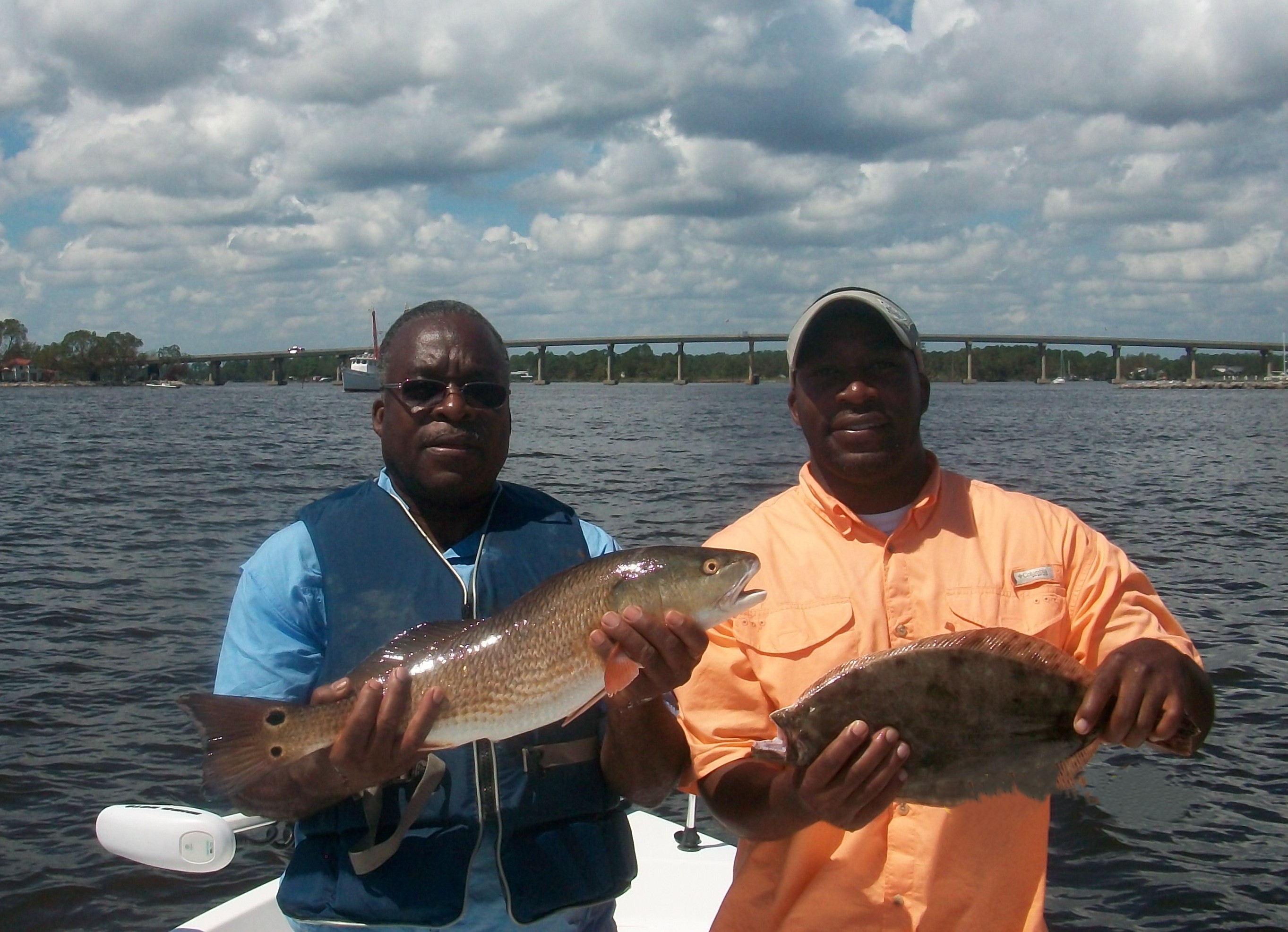 Image of Travis fishing with his dad.