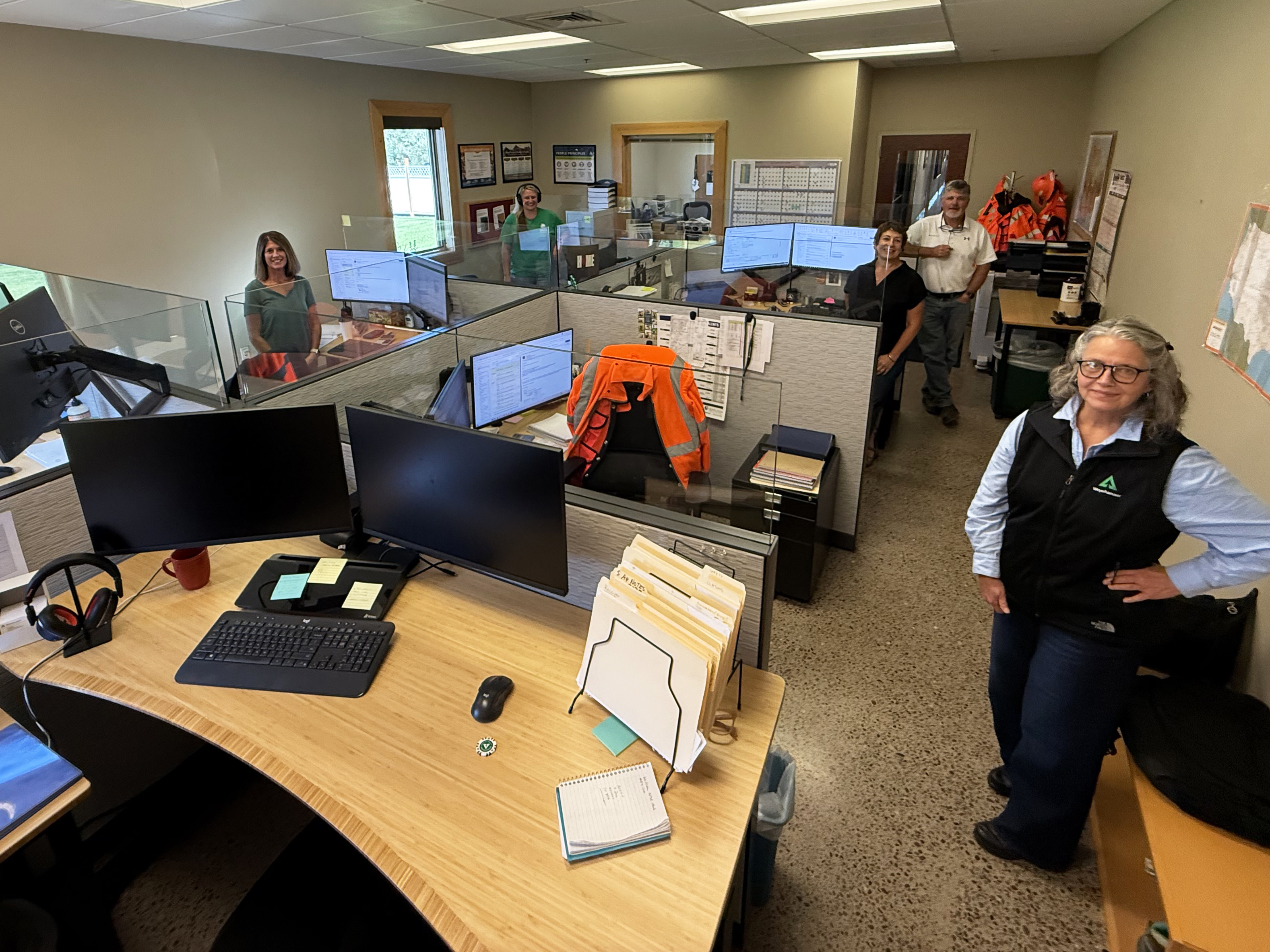 Image of Rebecca and her team in the office.