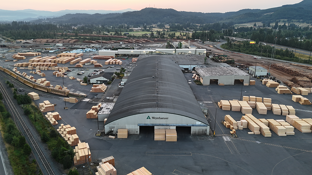 Image of the Weyerhaeuser Distribution Center in Cottage Grove with stacks of lumber throughout the grounds ready for shipoment.
