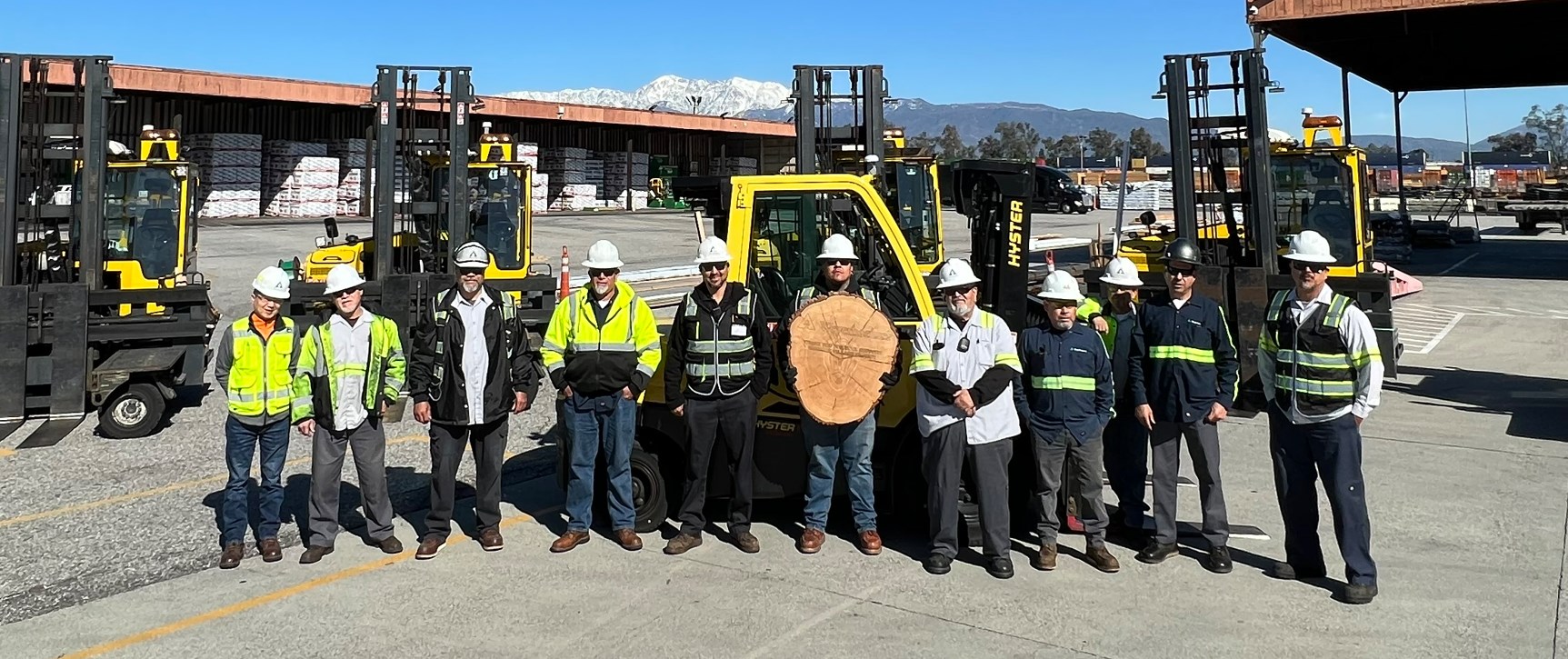 Image of the Fontana day crew with the plaque from San Marcus High School.